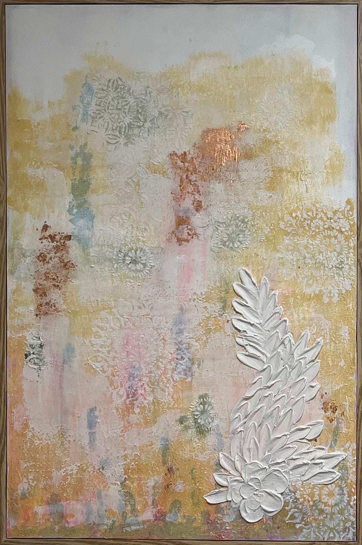 Warm ochre abstract with raised white leaf relief down the right side.