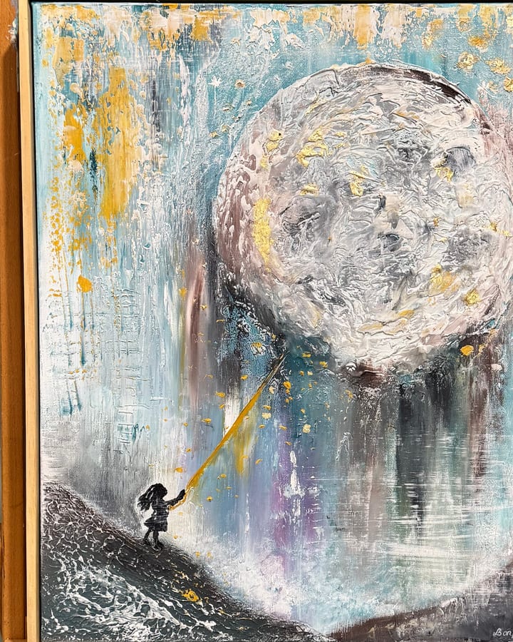A small figure reaching a golden thread up to a huge textured moon.